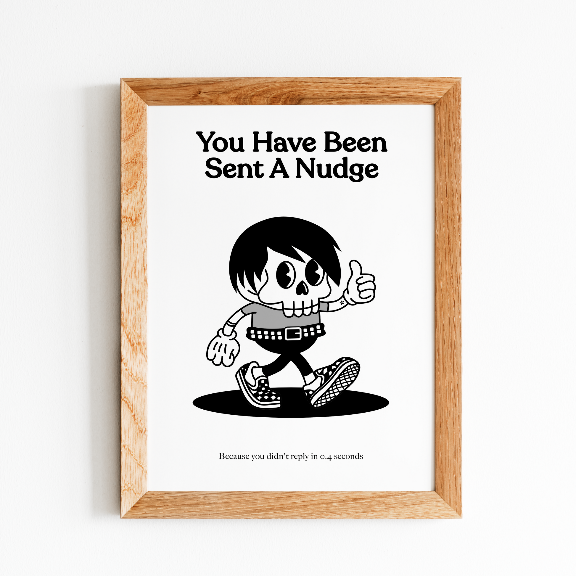 Framed print with a cartoon character and text about sending a 'nudge' on a white background